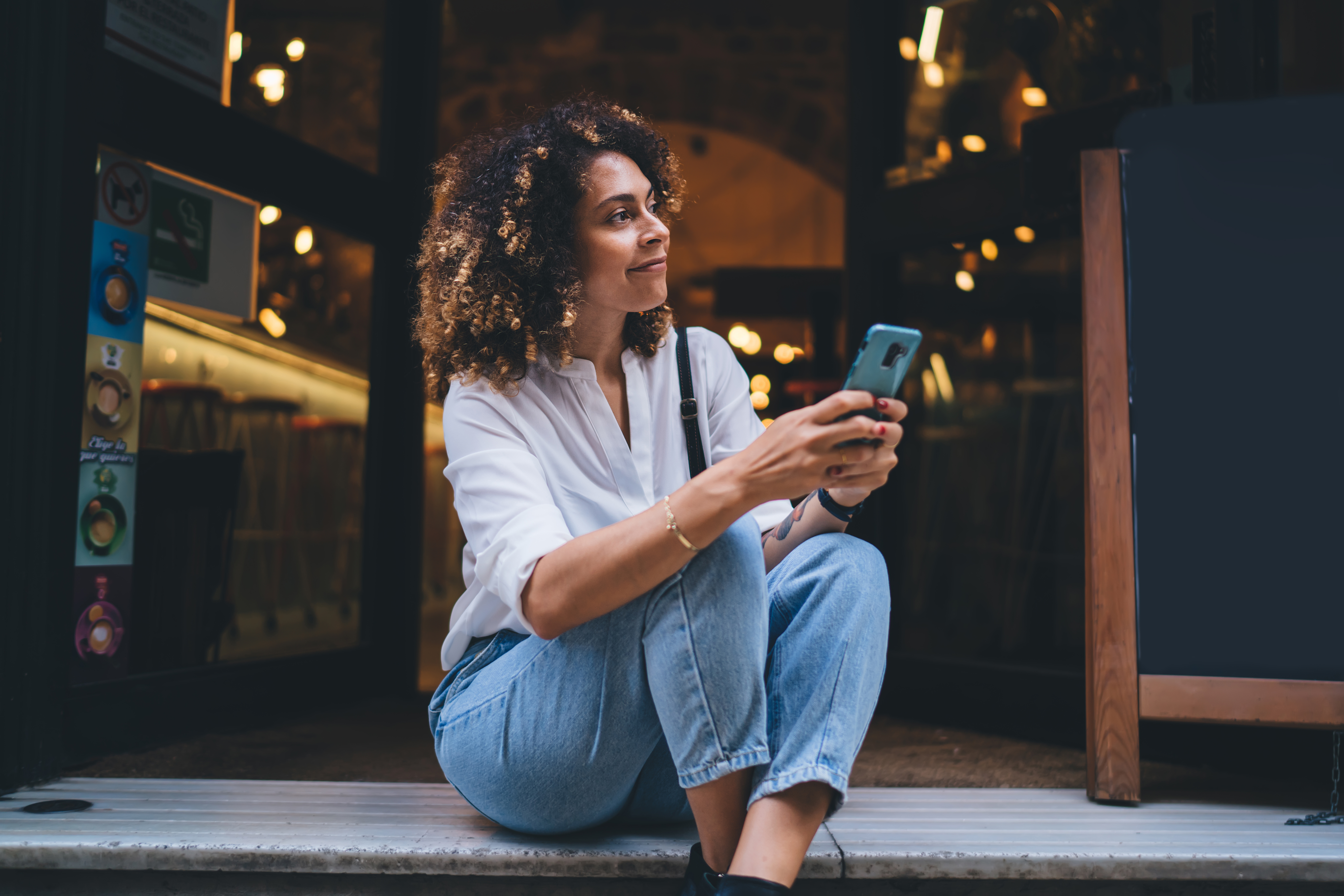Curly Hair woman with her phone - Copy