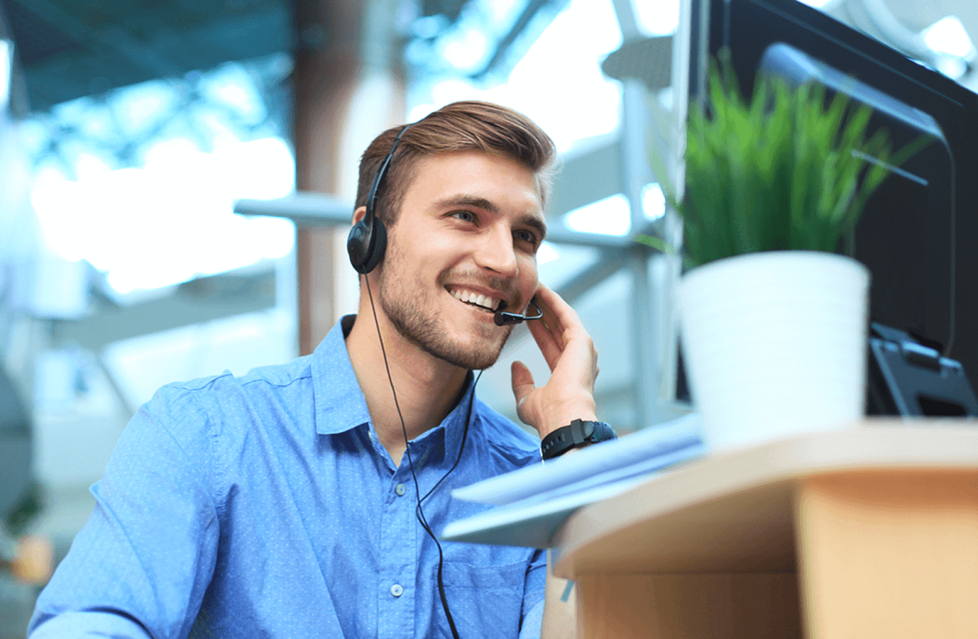 young man using headset to enhance call center agent performance