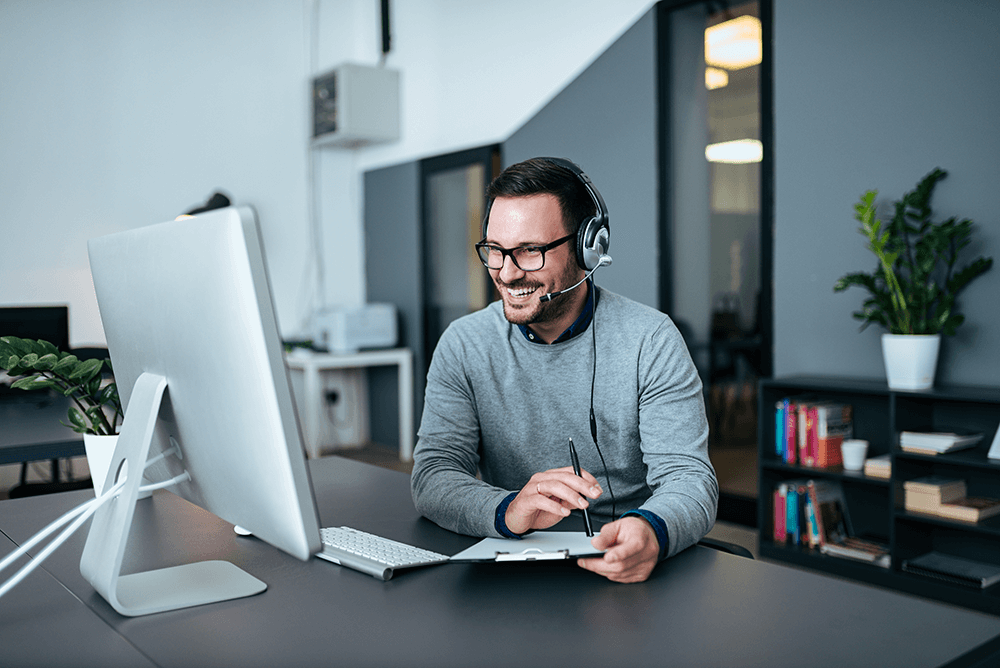 man in call center on computer reducing your average handle time