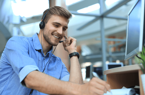 guy smiling on phone overcoming objections in collections